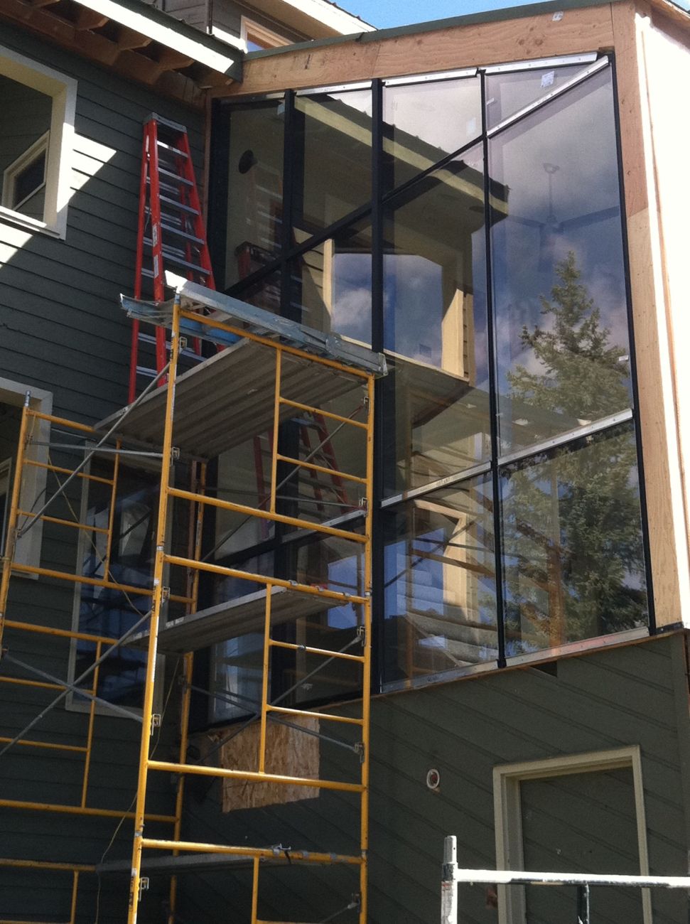 Custom glass window wall during installation